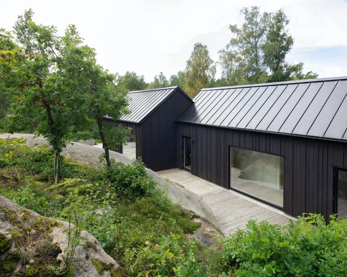 Factory black stained timber cladding boards — ThermoWood and Siberian larch black finish UK