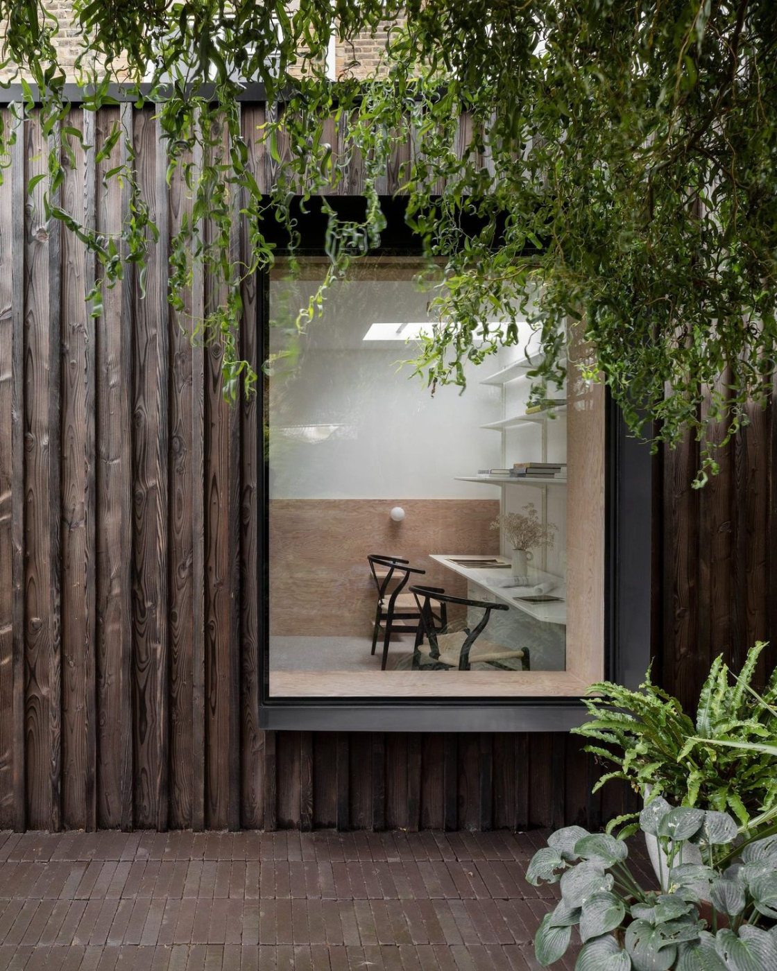 Charred brushed timber cladding on UK garden room — contemporary black exterior finish