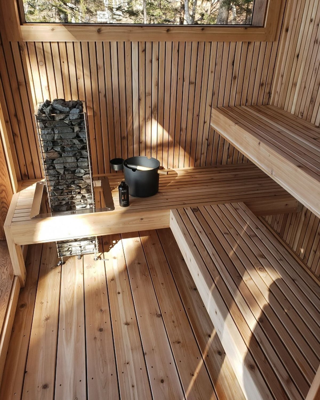 ThermoWood tongue and groove cladding on sauna interior walls and ceiling — UK garden sauna