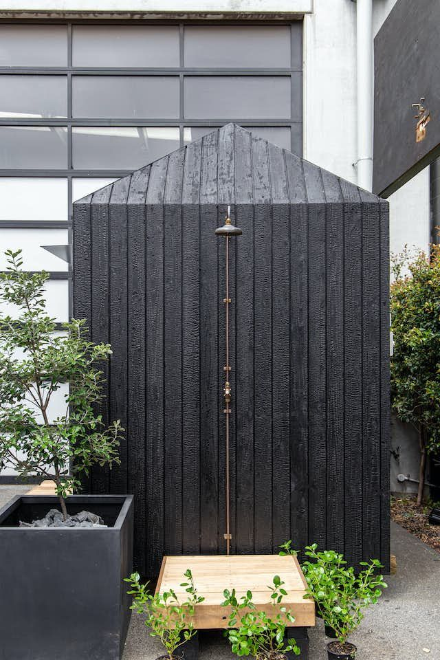 Outdoor garden sauna with black timber cladding exterior — UK residential project
