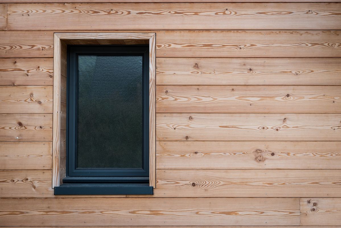 Modern house exterior with horizontal timber cladding boards