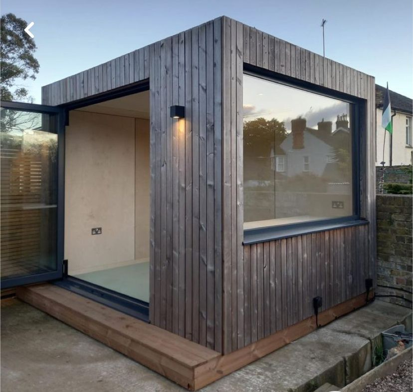 ThermoWood shadow gap cladding on contemporary UK garden office — warm natural timber finish