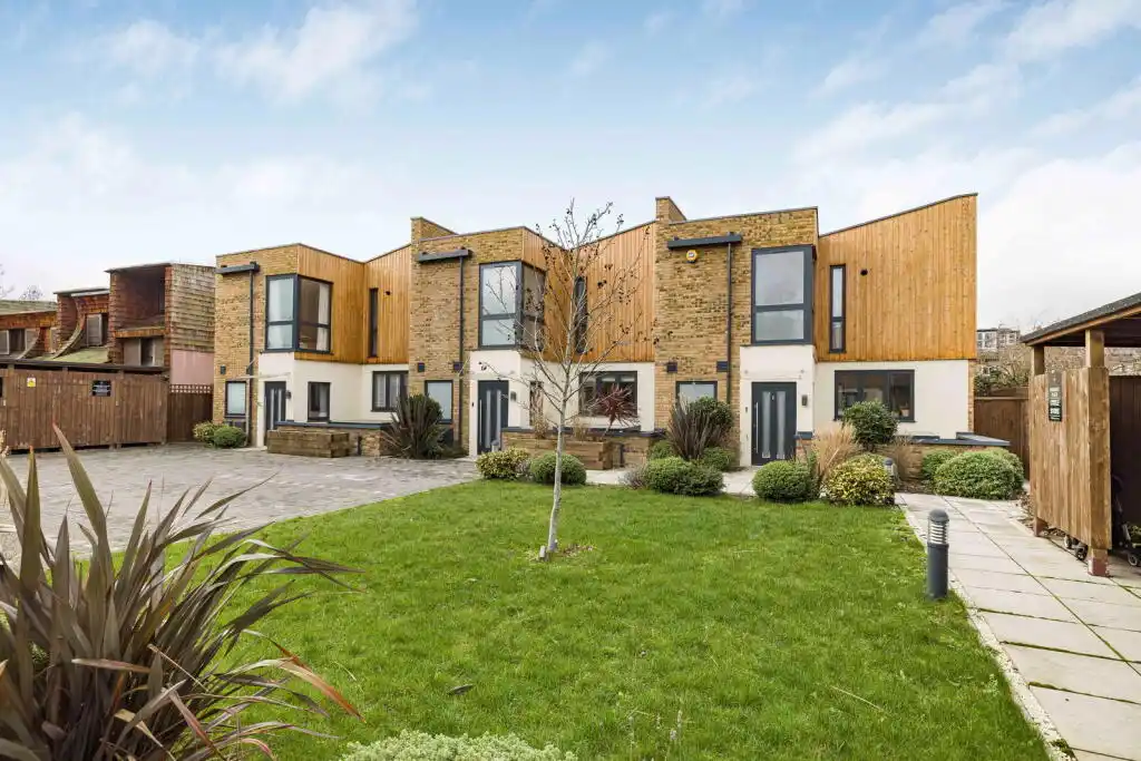 52 Clarence Avenue Clapham — completed Siberian larch shiplap cladding on new build residential houses