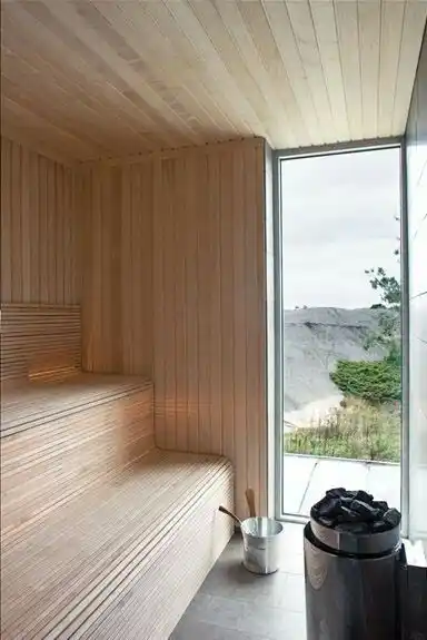 Alder sauna tongue and groove cladding UK — close up profile detail on sauna interior wall