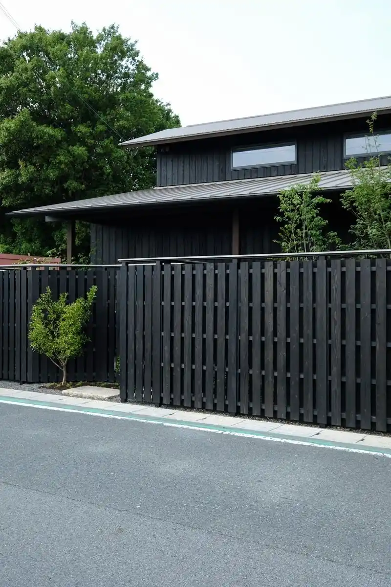 Black fencing boards UK — close up comparison of black timber fence board options