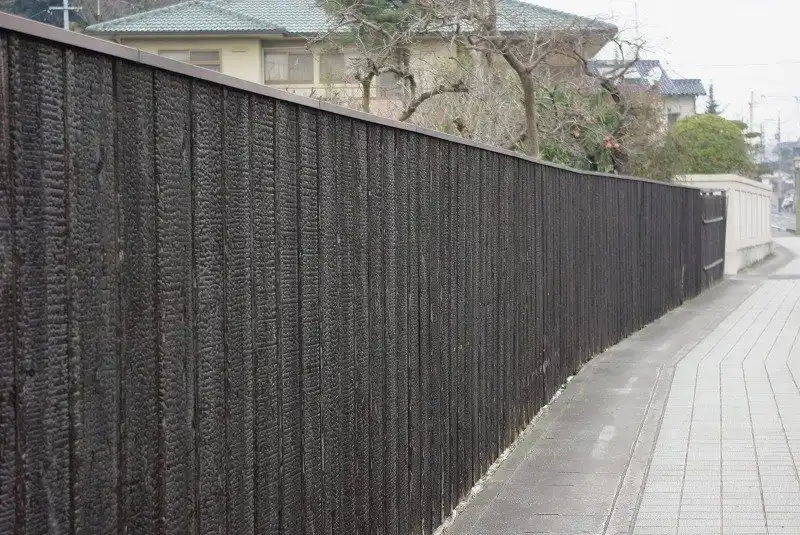 Charred Siberian larch fencing UK — natural black finish without paint or stain