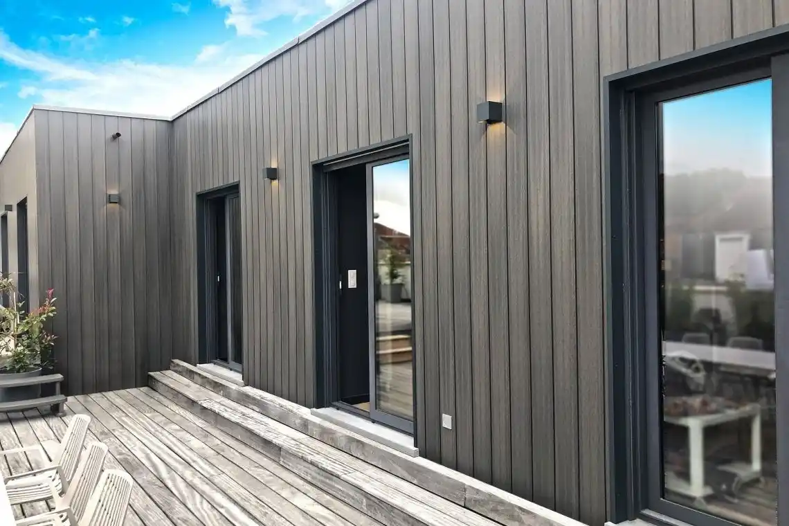 Vertical composite cladding on UK garden room — WPC cladding contemporary exterior finish