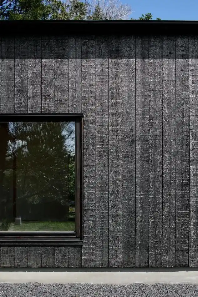 Deep charred timber cladding on UK garden room — bold black exterior with zero maintenance requirement