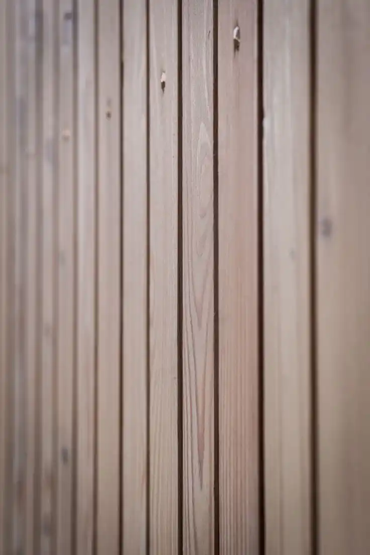 Douglas fir external cladding on contemporary UK building — warm reddish-brown timber facade