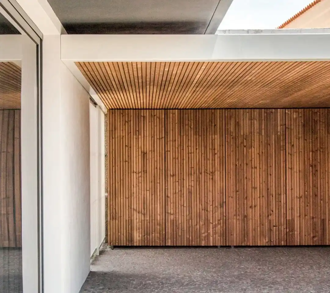 Lunawood triple shadow gap installed vertically creating batten look effect on contemporary building