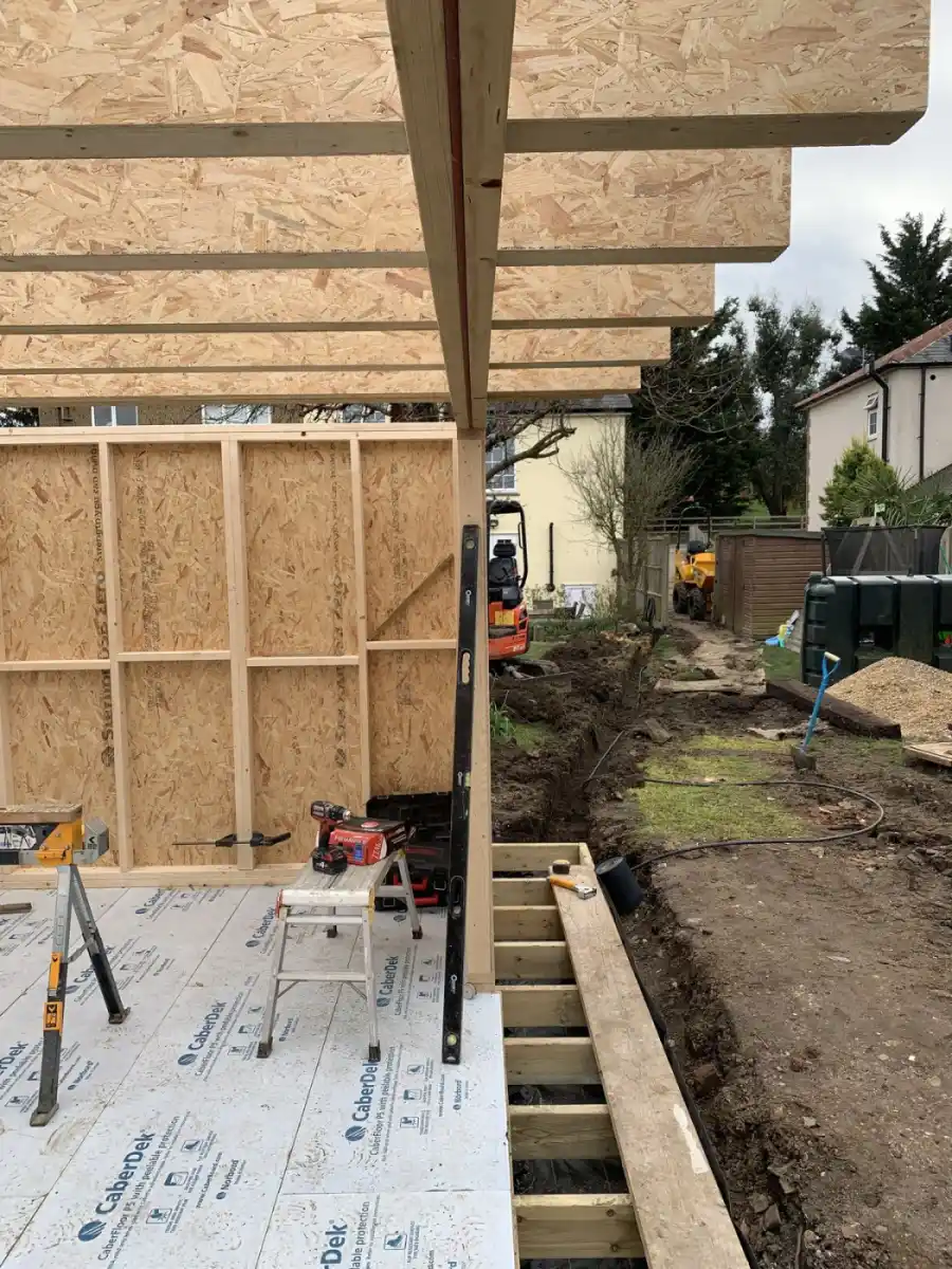 Garden room timber frame ready for cladding UK — structural frame before membrane and battens