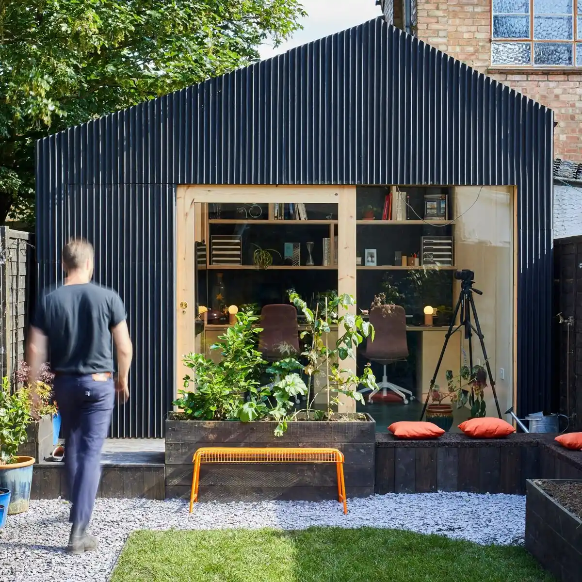 Vertical black timber cladding on UK garden room — contemporary garden office exterior