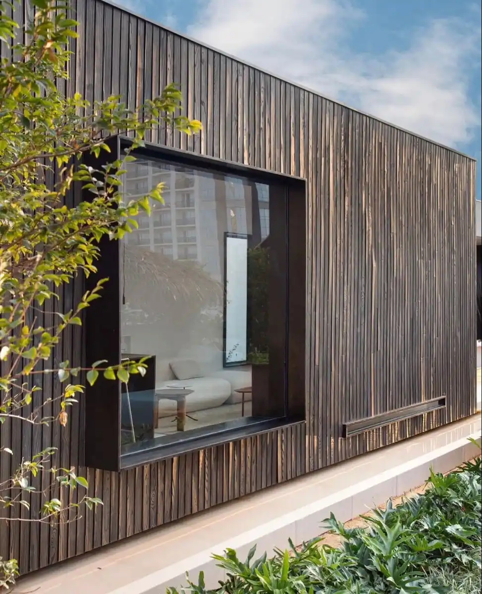 Garden room window reveal detail — timber cladding with correctly detailed window surround UK