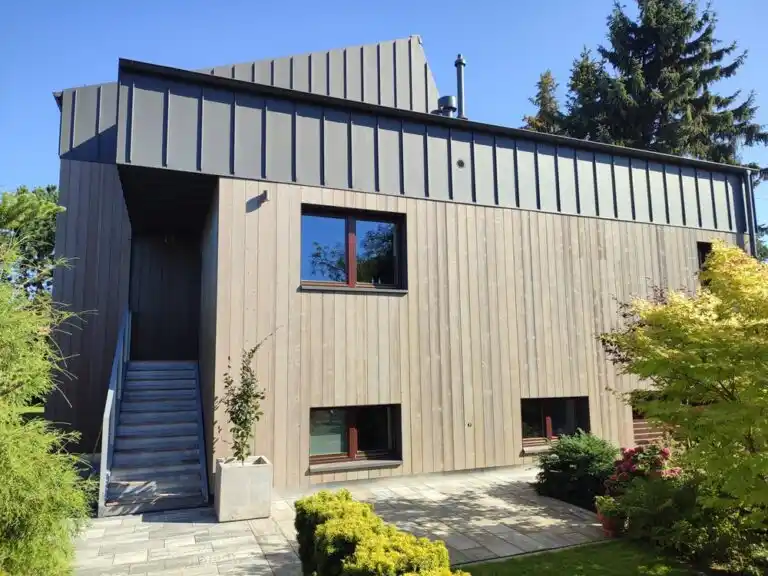 Timber cladding new build housing UK — full elevation timber cladding on new build house