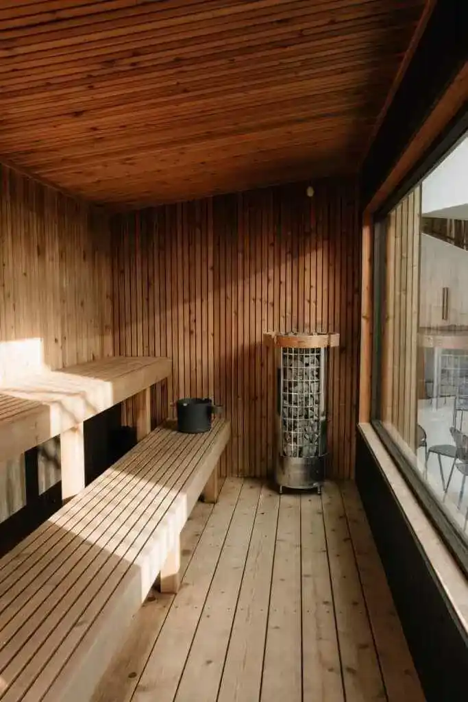 ThermoWood Pine interior cladding inside UK garden sauna — walls and ceiling