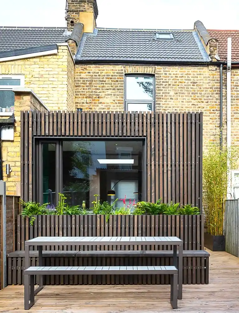 Modern timber cladding on London house extension — contemporary natural timber exterior