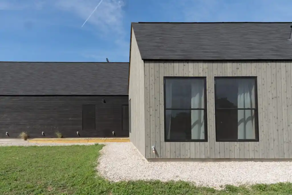 Barn cladding UK — grey Nordic spruce timber cladding on barn conversion exterior