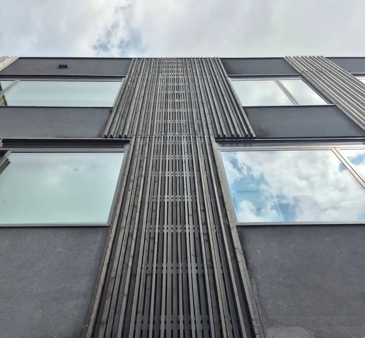 Fire rated timber cladding commercial UK — EuroClass B Siberian larch B-s1-d0 Oasis Academy Hadley