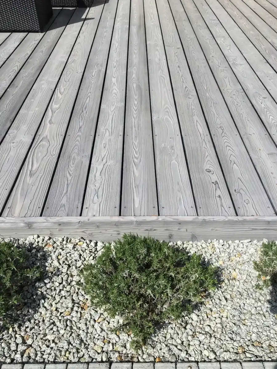 Siberian larch decking weathered UK — silver grey naturally aged larch deck boards