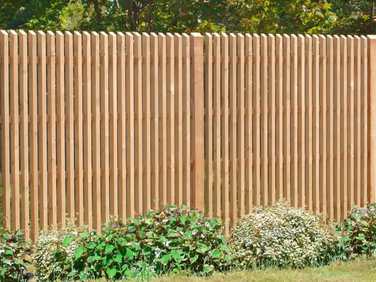 Siberian larch fencing UK — natural larch timber fence panels in garden