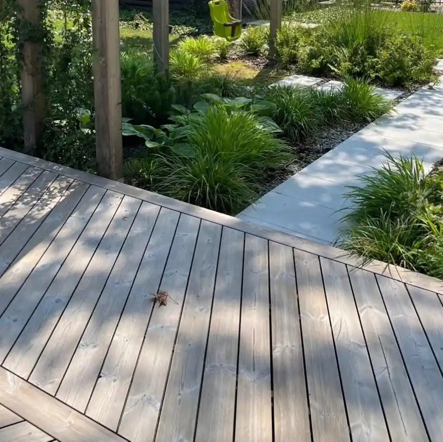 ThermoWood weathered decking boards UK — natural silver-grey patina aged thermowood deck