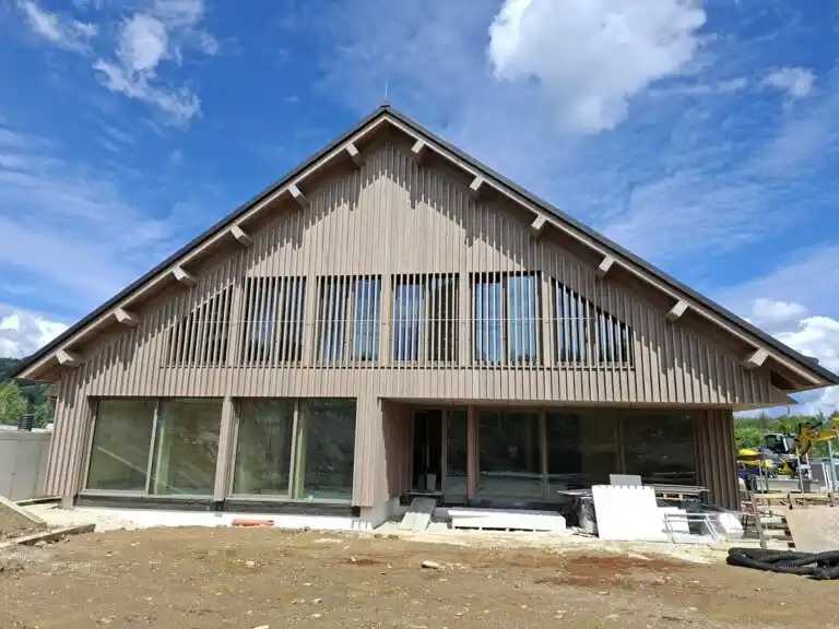 ThermoWood cladding weathered grey on UK house — timber cladding performing in wet UK climate