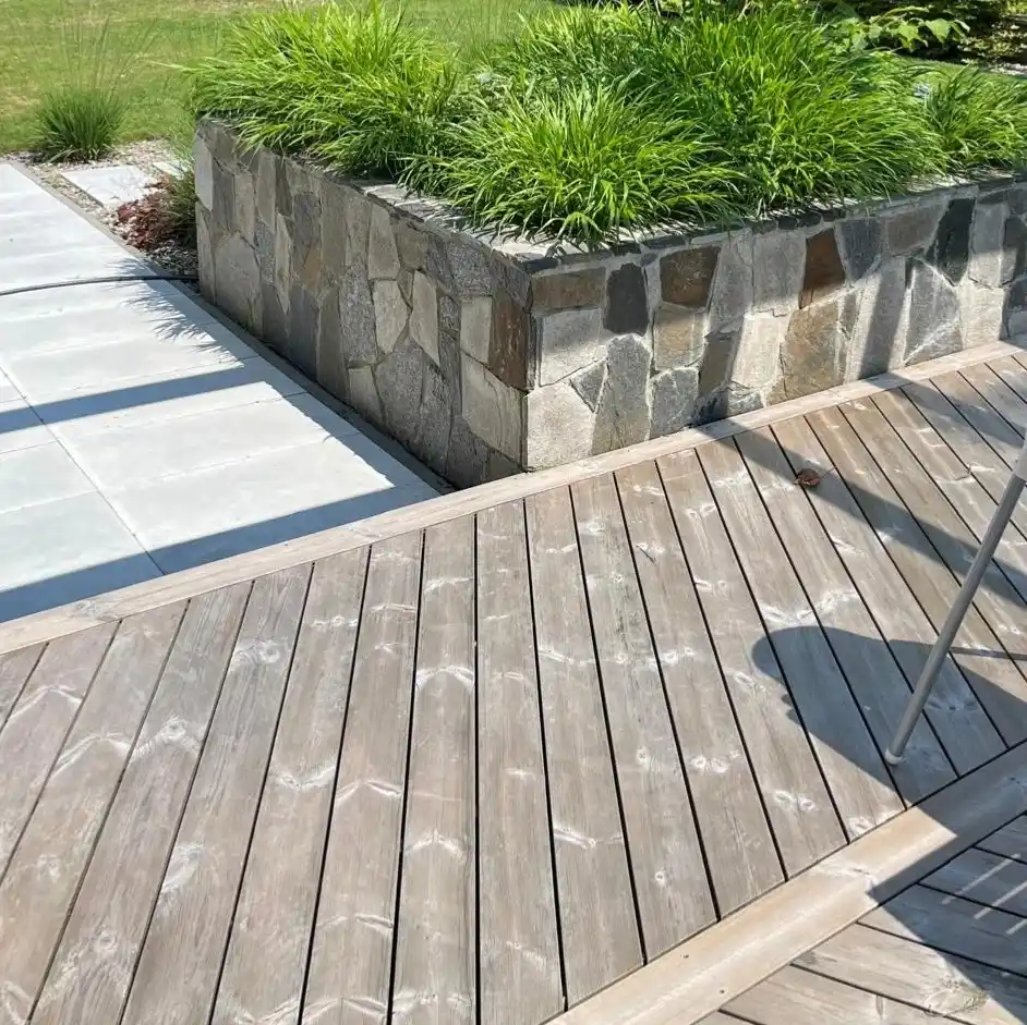 ThermoWood pine decking weathered UK — naturally aged silver-grey thermally modified pine deck