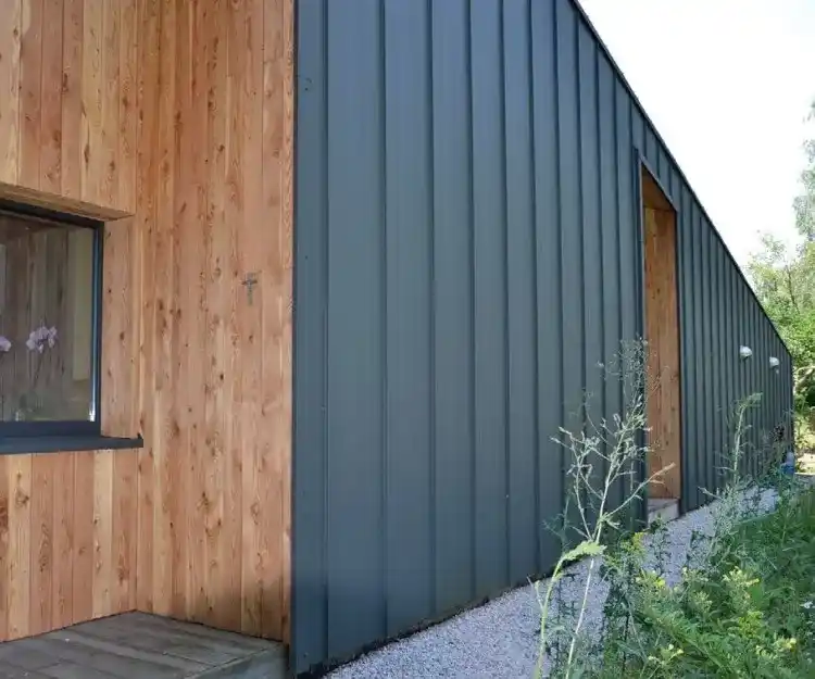 Contemporary timber cladding elevation UK — natural timber cladding on modern house facade