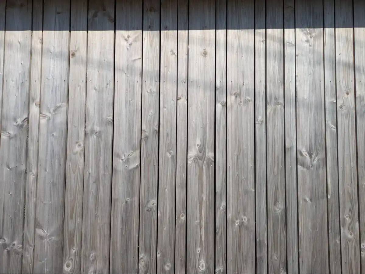 Vertical shiplap cladding on UK garden building — contemporary upright installation exterior