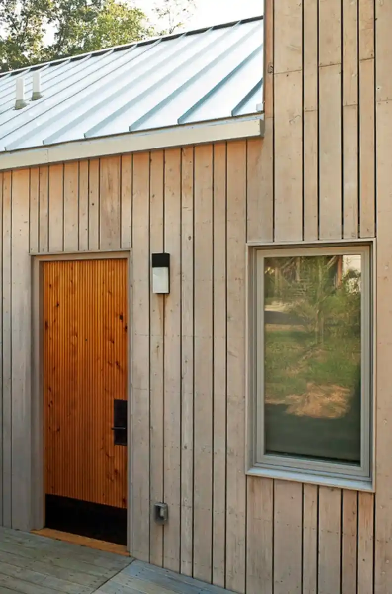 Vertical timber cladding UK — contemporary vertical larch cladding on house exterior