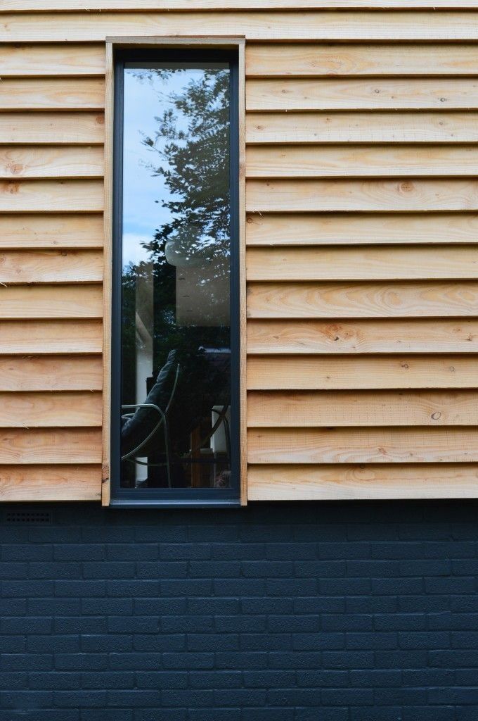 horizontal feather edge timber cladding profile on contemporary house extension