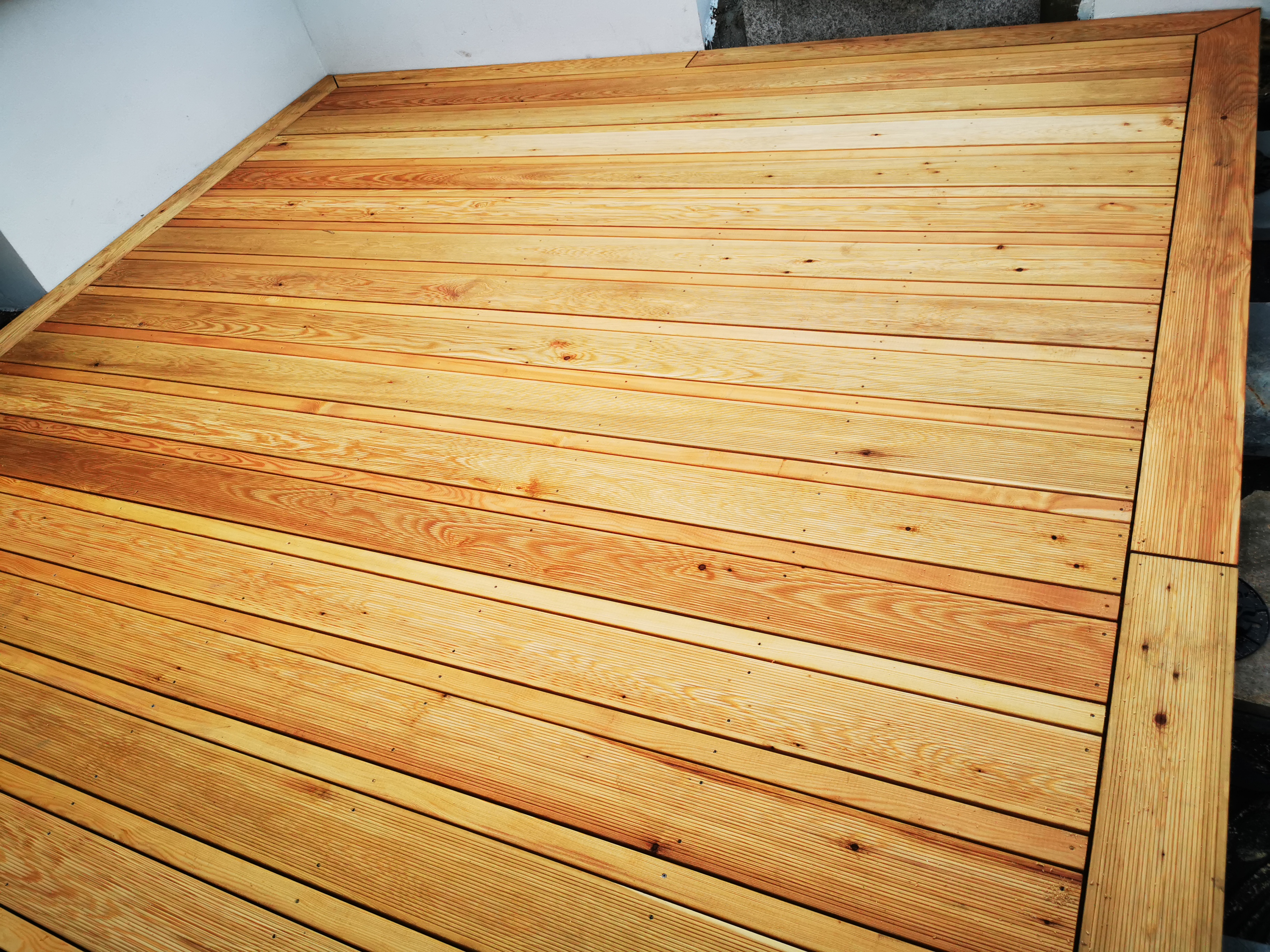 Timber decking board profiles showing smooth and ribbed surfaces